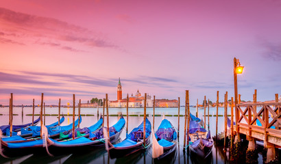 Fototapeta na wymiar Gondolas in Venice at sunrise