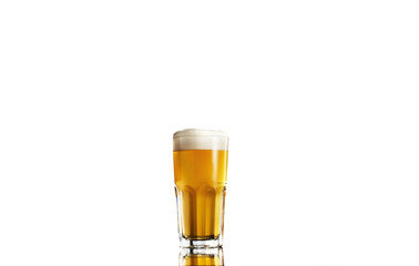 cold beer in a glass on a white background