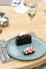 Chocolate cake with sorbet in restaurant