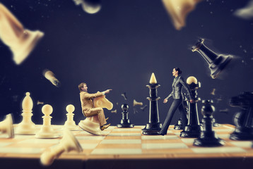 Man and woman on the chess board