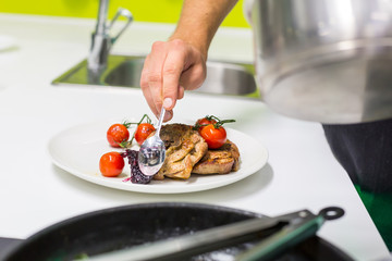 Man decorating dish