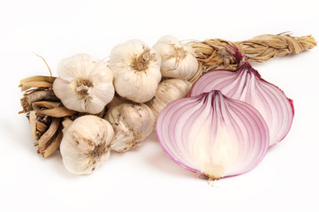 bunch of garlic and red sliced onion on white