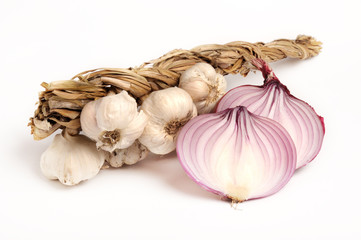 bunch of garlic and red sliced onion on white