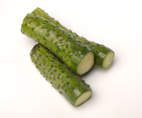 salted cucumber on white, traditional snack while drinking vodka