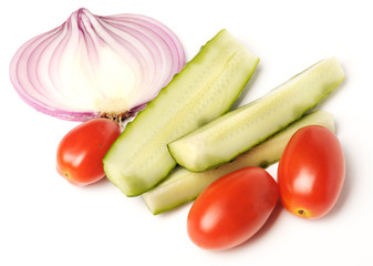 salted cucumber, red cherry tomatoes and sliced red onion on white, traditional snack while drinking vodka