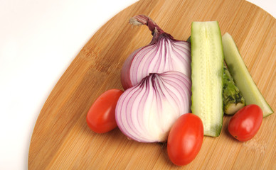 salted cucumber, red cherry tomatoes and sliced red onion Bamboo cutting board , traditional snack while drinking vodka
