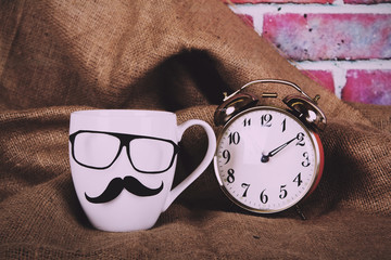 Coffee cup with a black hipster mustache  Vintage Retro Filter.
