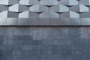 Wall of black metal futuristic new building. Abstract architectural pattern