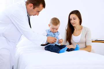 Little boy child  with his mother  at  health exam at doctor's office