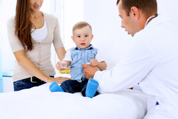 Little boy child  with his mother  at  health exam at doctor's office