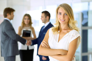 Fototapeta premium Blonde businesswoman looking at camera