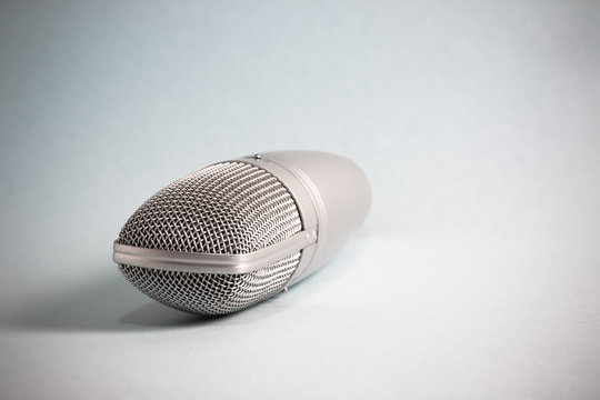 Vintage microphone with light and shadow