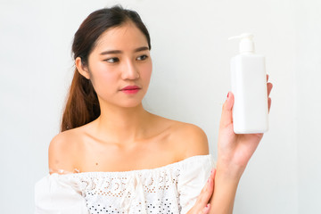 Body lotion Portrait of Beautiful  Woman looking at Camera. Beau