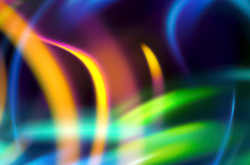 Colorful abstract  background. Glow lines. Curve lightings streaks on black background