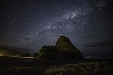 Fototapeten Milky way over Piha beach Auckland New Zealand © cloud9works