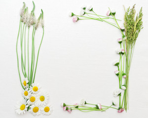 Naklejka na ściany i meble Wreath of chamomile and daisy on the white background