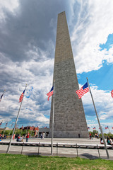 Fototapeta premium Washington monument surrounded by flags of the US