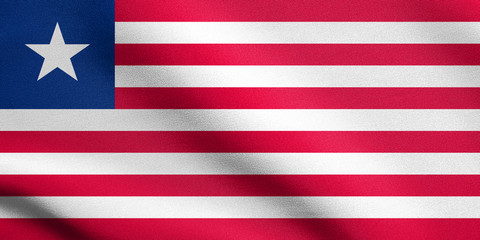 Naklejka premium Flag of Liberia waving with fabric texture