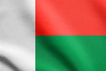 Obraz premium Flag of Madagascar waving with fabric texture