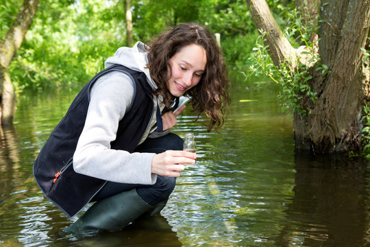 Young Attractive Biologist Woman Working On Water Analysis