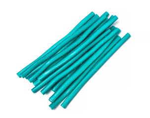 Sweet jelly licorice candy sticks in turquoise, isolated on white background