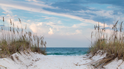 White sandy beach path to the ocean.