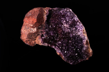 gemstone, druse of purple amethyst on black background, used toning og the photo 