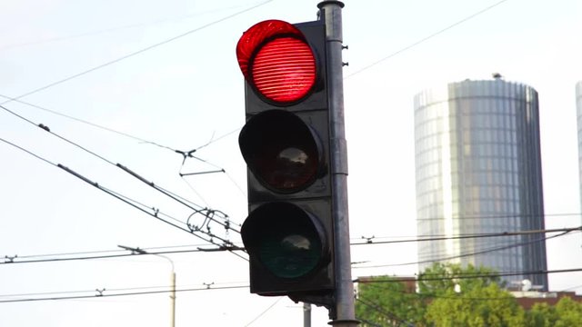 traffic lights on street turning blinking from red stop to green go semaphore
