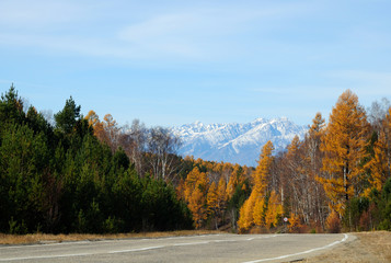 blue sky over the vast steppes, Tunka valley, mountains covered with snow, Sayan mountains. Used deep toning of the photo 