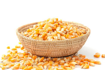 Corn seed on wooden dish isolated on white