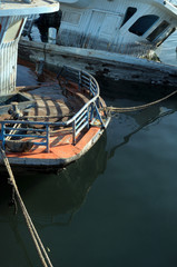 broken sunken pleasure boat in the water, used toning of the photo