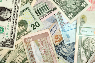 background consisting of randomly mixed banknotes from different countries