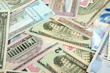 background consisting of randomly mixed banknotes from different countries