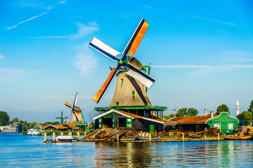 Fully operational historic Dutch Windmills along the Zaan River at the village of Zaanse Schans in the Netherlands