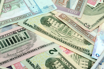 background consisting of randomly mixed banknotes from different countries