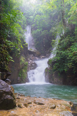 Naklejka na ściany i meble Amazing beautiful waterfalls in deep forest at Phlio Waterfall in Namtokphlio national park,Chantaburi Province, Thailand.