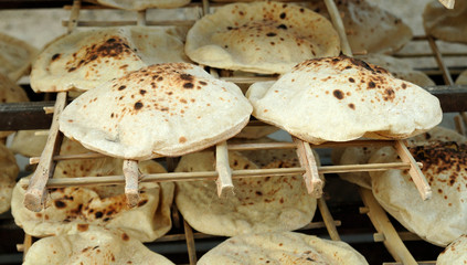 freshly baked Arabic bread. bakery in Egypt.photo toned