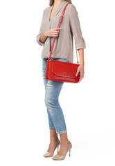 Naklejka premium Woman holding a handbag isolated on white background