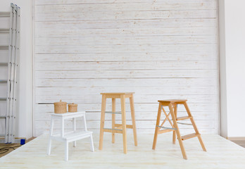 chairs standing in white room
