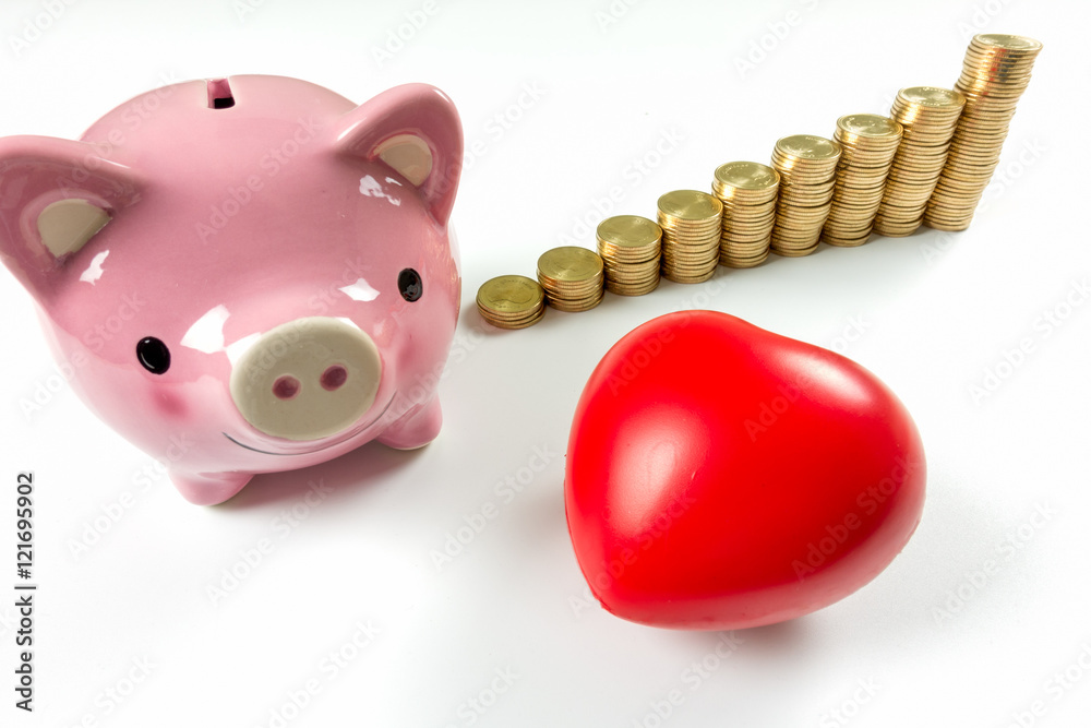 Wall mural piggy bank, calculator, red heart and gold coins on white backgr