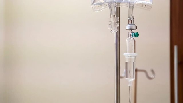Closeup on intravenous or IV drips from medicine bag in hospital