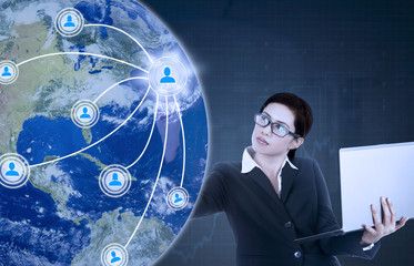 Woman with laptop and social network icon