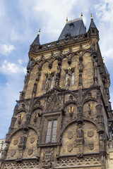 Fototapeta na wymiar old stone powder tower in Prague Czech republic and blue cloudy sky