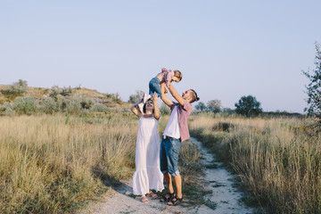 Family enjoying life outdoors in field