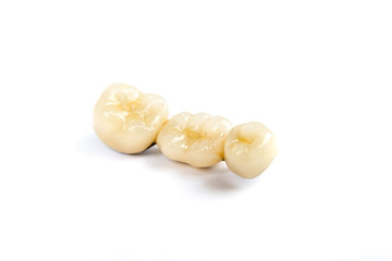 Dental ceramic tooth crowns on white background. Isolated.