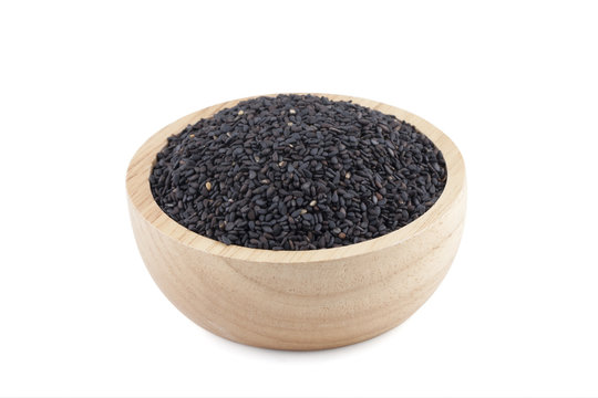 black sesame seeds in wooden bowl