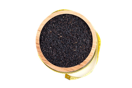 black sesame seeds in wooden bowl