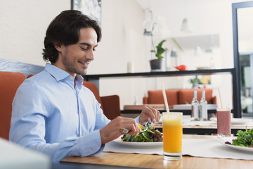 Man and woman having lunch at cafe