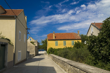 Fototapeta na wymiar Yellow rustic house in Zlarin,Croatia