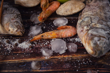 Food wooden background with Seafood, sticks, lime, salt. Copy sp